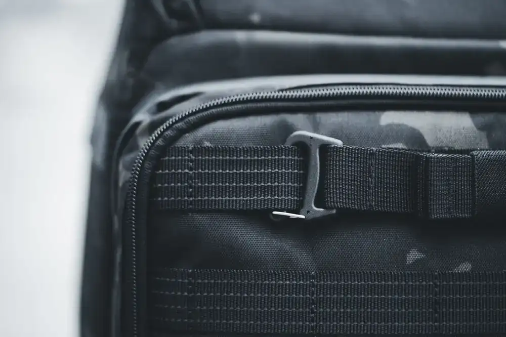 Reinforcing a torn backpack shoulder strap with heavy duty thread