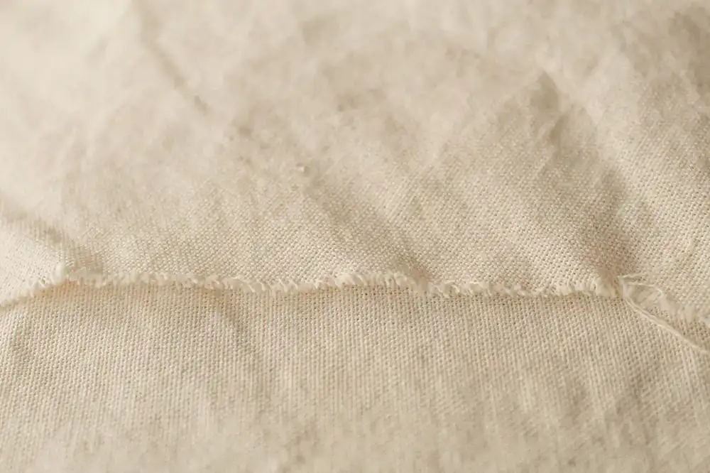 Close up of a repaired tent fly with reinforced stitching