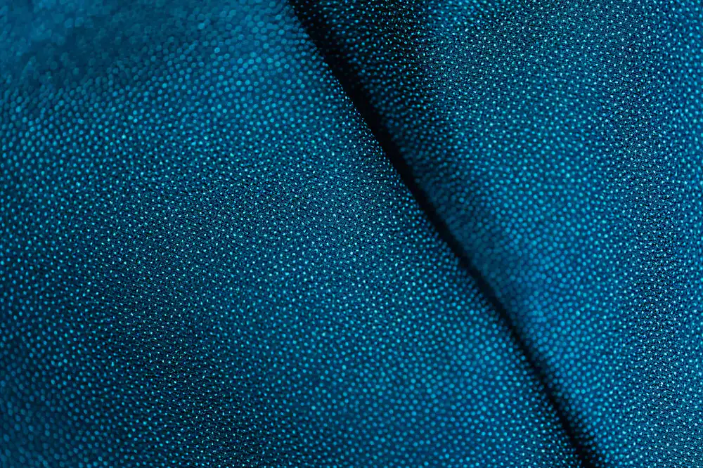 Macro view of waterproof seam taping applied to a tent fly