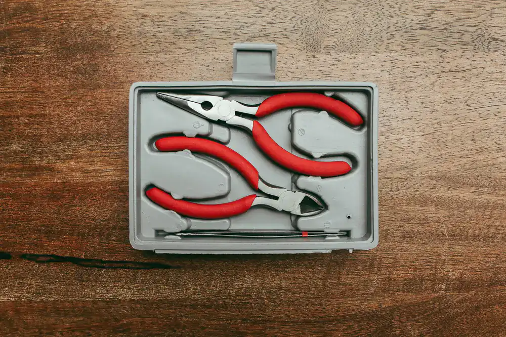 Specialized pliers and hardware for zip track repair